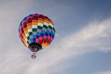 Hot Air Balloon in flight. Hot air ballooning flying in the sky in Switzerland.