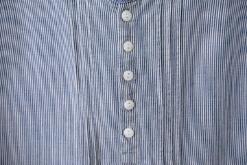 Full frame Button down shirt on handmade sewing lace in woman shirt.close up.