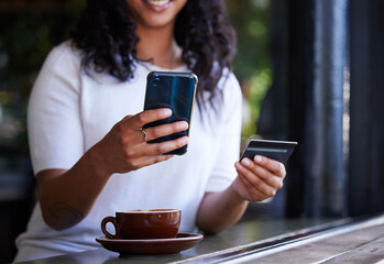 Woman, hands and phone with credit card for online shopping, ecommerce or purchase at coffee shop....