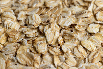 Poured a large amount of oat flakes close-up