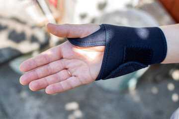 Universal fixator of the wrist joint on the patient's hand. Bandage for fracture and sprain of the...