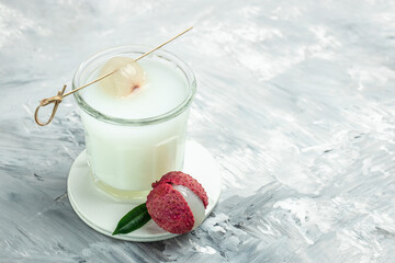 Organic leechee sweet fruit with litchy juice in glass. Restaurant menu, dieting, cookbook recipe top view