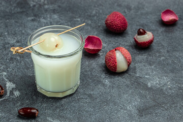 Lychee juice with fruits on a dark background, Restaurant menu, dieting, cookbook recipe top view