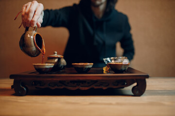 Chinese traditional puerh tea ceremony. Shepherd, chahay and gaiwan pour puehr tea