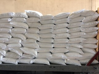 Chemical fertilizer The product stock is packed in sacks, stacked in the warehouse, waiting for delivery.	