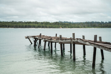 old wooden footbridge, pier that goes into the water