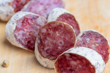 Chunks of sliced sausage with white mold