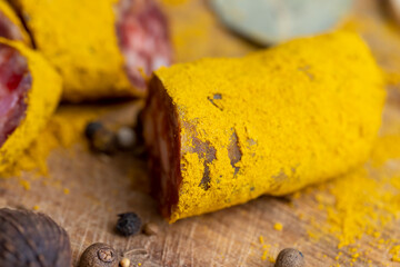 Sliced beef salami with spices and lots of turmeric