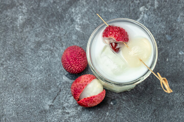 Closeup of fresh lychee juice with fruits, banner, menu, recipe place for text, top view