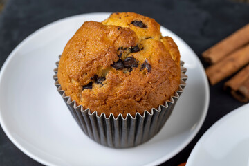 Sweet fresh cupcake with chocolate pieces