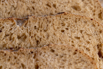 Cut into pieces fresh baked loaf of dark bread