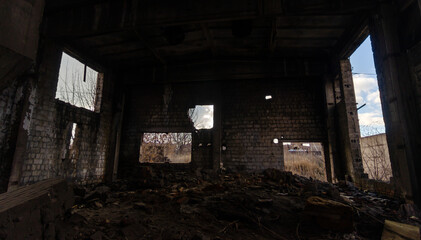 Fototapeta na wymiar inside a destroyed and burnt house in Ukraine