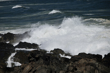Ocean waves crashing on a rocky shore