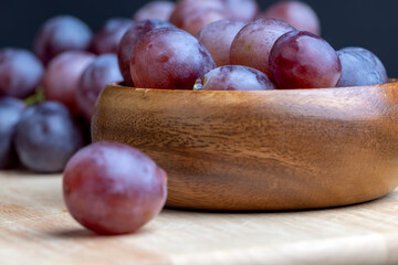 Ripe blue grapes on the kitchen table