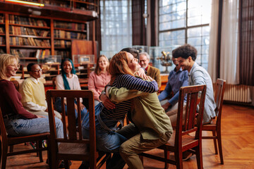 Patients hugging in therapy.