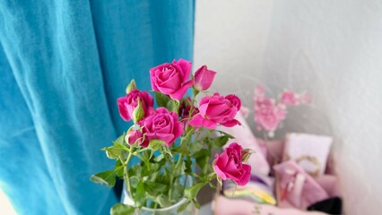 Close-up of a bouquet of small pink roses wrapped in paper