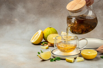 Bergamot tea in transparent cup with fresh bergamot fruit, Clean eating, dieting, vegan food concept. top view