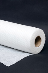 Roll of fabric napkins on a black background