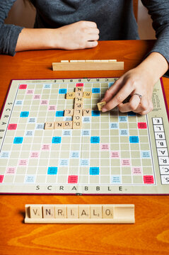 Woman Playing A Scrabble Game