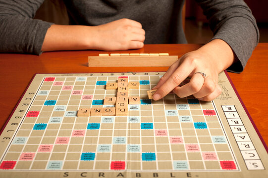 woman playing a Scrabble game