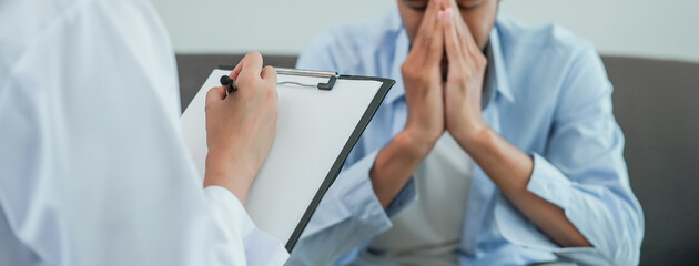 Men talk with a psychologist during talking therapy stressed mental health at office