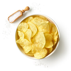 Bowl of crispy potato chips or crisps with salt