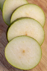 Fresh juicy pear cut into pieces and pieces