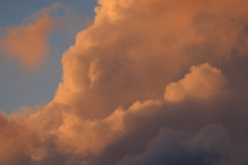 Fototapeta na wymiar Pink clouds lit by early morning sun 