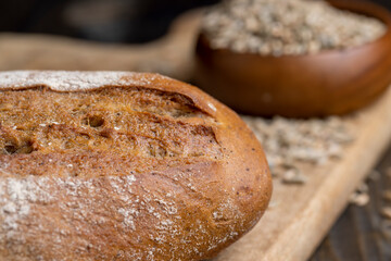 A whole freshly baked loaf of dark bread