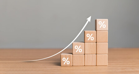 Interest rate financial and mortgage rates concept. Wooden blocks with Icon percentage symbol and...