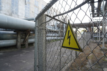 High voltage sign on the territory of the power plant