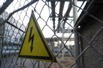 High voltage sign on the territory of the power plant