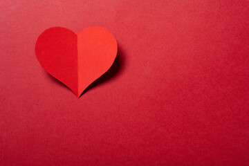a heart on a red background with copy space