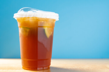 side view cup of iced lemon horizontal composition