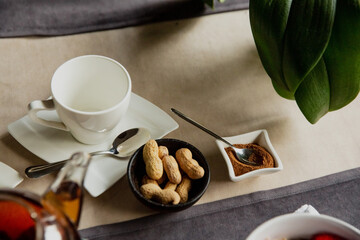 tea cup and pistachio nuts.