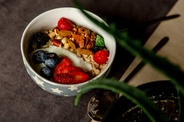 Breakfast oatmeal with fruits and nuts