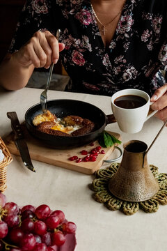 Girl Having Breakfast In The Kitchen Early In The Morning