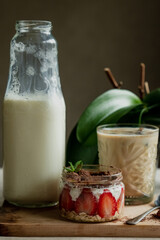 Milk bottle, tiramisu with strawberry frozen coffee with milk, delicious breakfast