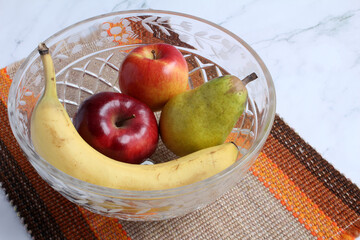 Fresh fruit in a crystal bowl.