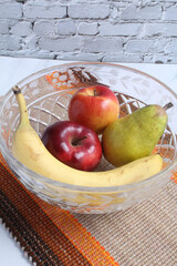 Fresh fruit in a crystal bowl.