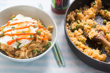 Kimchi fried rice with fried egg and sriracha