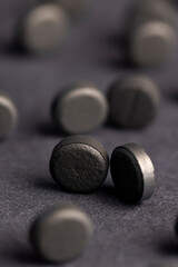 Open and unpacked tablets of black color close-up