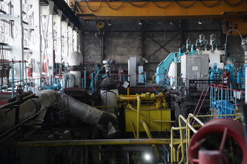 Almaty, Kazakhstan - 10.07.2022 : Pipes, valves and pressure sensors in the generator room at the heating plant.