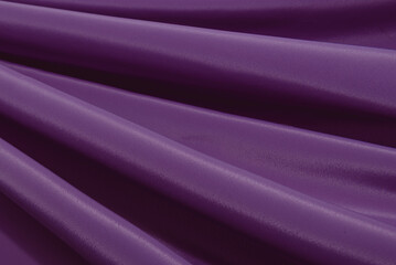Fototapeta na wymiar Black purple silk satin background. Copy space for text or product. Wavy soft folds on shiny fabric. Luxurious magenta background. Valentine, Christmas.Top view