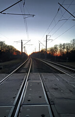 The railroad goes into the distance. Sunset, evening sky.