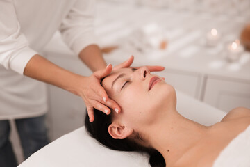 Naklejka premium Masseuse doing face massage to client