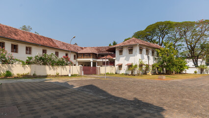 Fototapeta na wymiar Traditional tile roofed Kerala house beside Santa Cruz Cathedral Basilica.