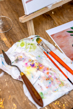 Painting Workshop. Painting tools on paint soiled canvas