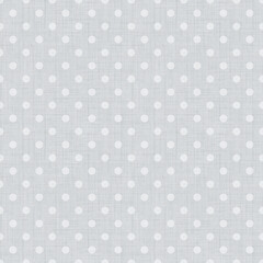 Seamless textured simple polka dot pattern. Small white polka dots on a light gray background.