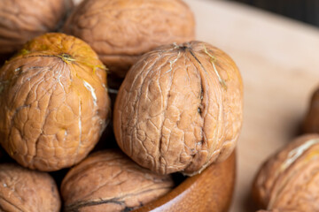 Unpeeled walnut harvest on the table